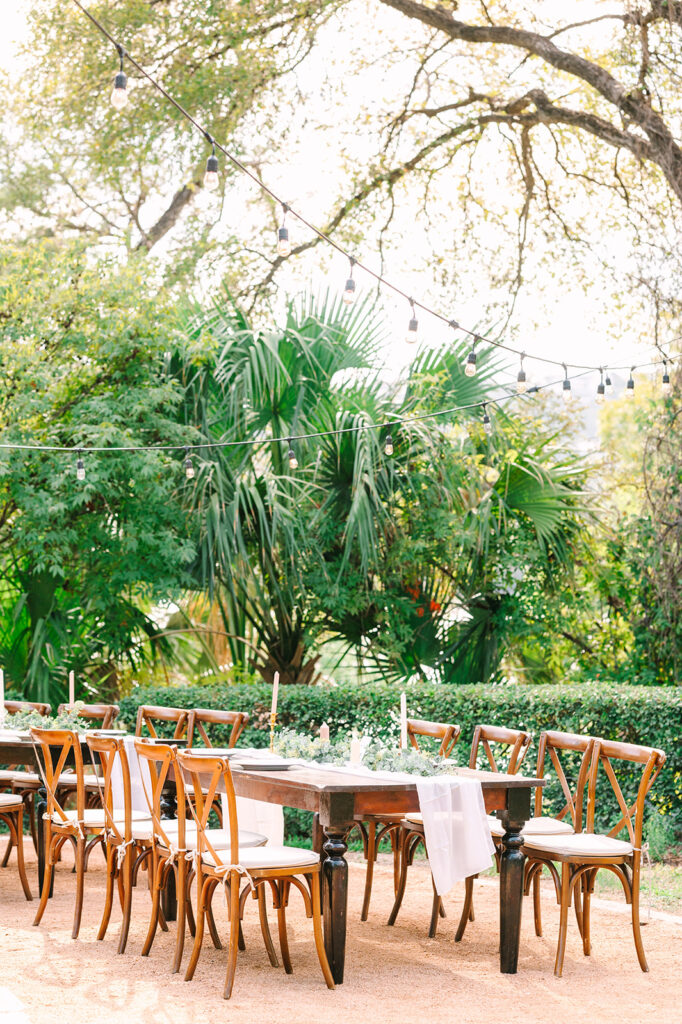 reception table under string lights