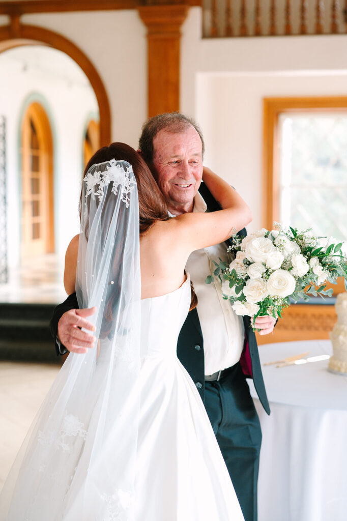 bride hugging dad