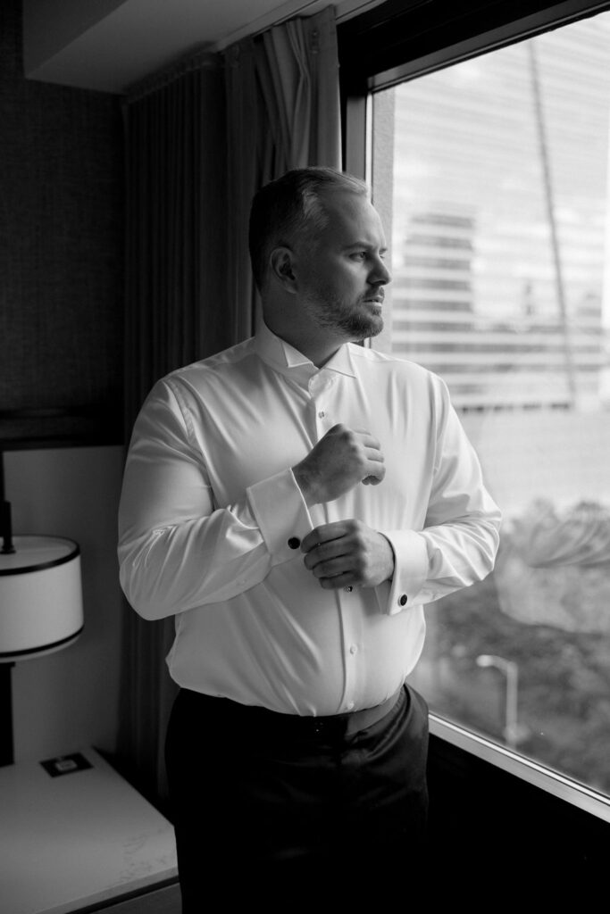 groom looking out window