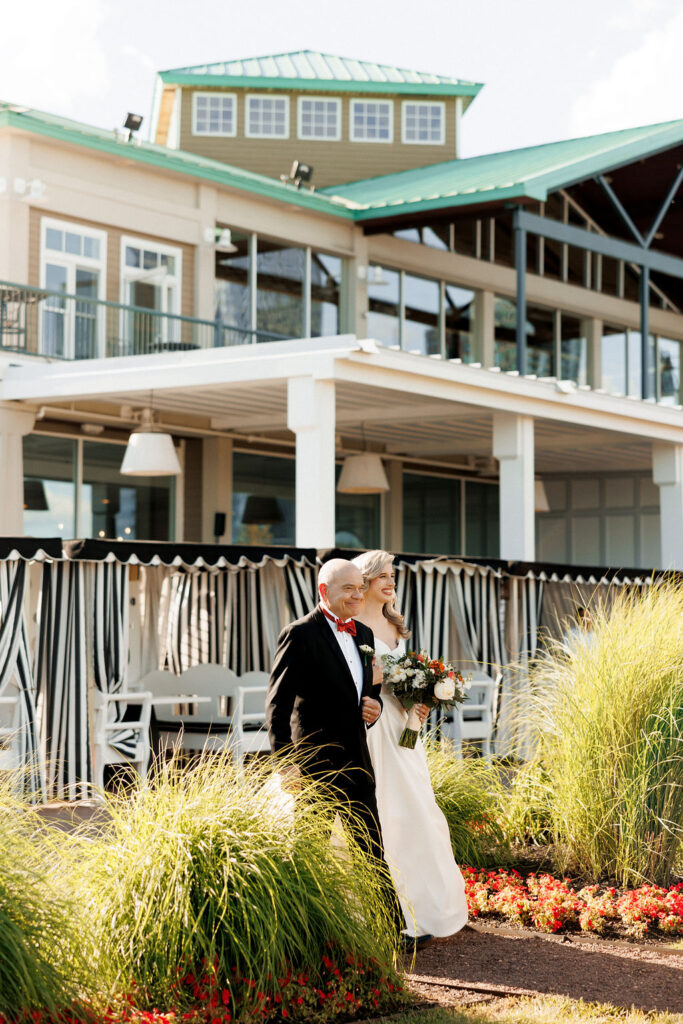 bride and father walking down the aisle at Liberty House